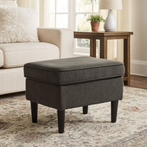 Vista ambientata pouf da salotto in tela marrone scuro con piedini alti di forma rettangolare - Lilibet totò piccinni