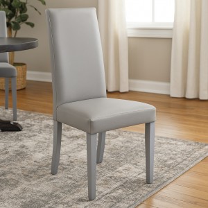 Vista ambientata Sedia imbottita in similpelle colore Effetto nabuk Grigio con struttura e gambe in legno modello Denver Totò Piccinni