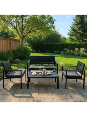 Vista ambientata set da giardino colore Nero divano 2 poltrone e tavolino struttura in metallo e polietilene modello Haiti Totò Piccinni