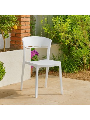 Vista ambientata Sedia in Polipropilene in fibra di vetro colore Bianco design impilabile modello Delta Totò Piccinni