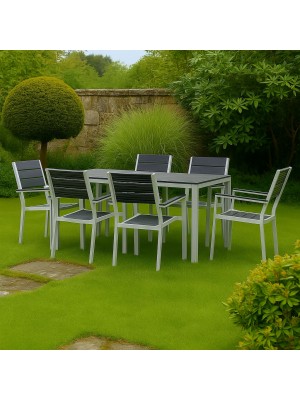 Vista ambientata set pranzo tavolo messico 158x78 con 6 sedie con braccioli messico struttura in metallo e polietilene effetto legno colore grafite