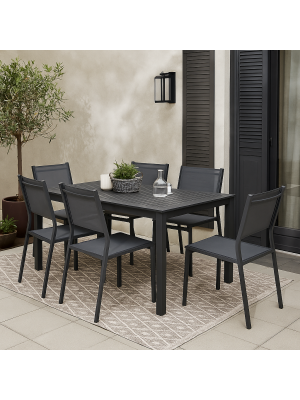 Vista ambientata Set pranzo da esterno con tavolo allungabile in alluminio 160/240 con 6 sedie senza braccioli modello Linosa Totò Piccinni