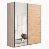 Vista diagonale con ante chiuse Armadio moderno in legno struttura Cashmere con 2 ante scorrevoli rovere artisan e specchio modello Sliding Totò Piccinni