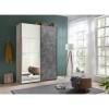 Vista ambientata Armadio design in legno struttura Noce Brera con 2 ante scorrevoli, 1 Cemento e 1 a Specchio modello Sliding Totò Piccinni