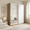 Vista ambientata con ante chiuse Armadio moderno in legno struttura Noce Brera con 2 ante scorrevoli, 1 Bianco Lucido e 1 a Specchio modello Sliding Totò Piccinni