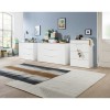 Vista ambientata Mobile contenitore in legno colore "Cemento/Bianco Laccato" con 3 cassetti e 2 ante modello Zenit Totò Piccinni
