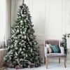 albero innevato con pigne Noel Totò Piccinni