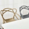 Sedie Design in polipropilene tortora e grigio - Totò Piccinni Infinity vista obliqua sotto un tavolo bianco